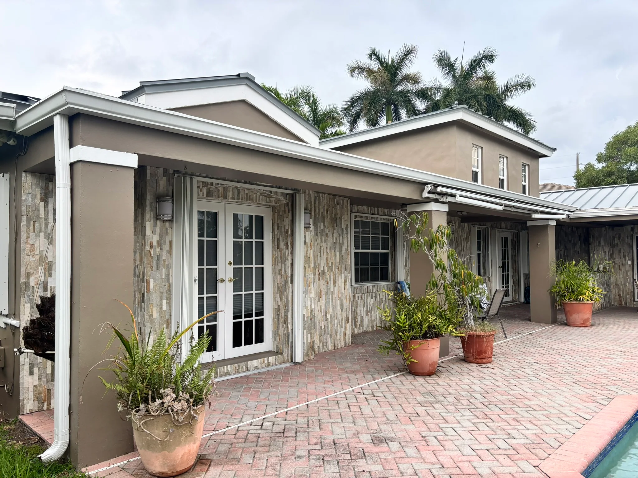 Careful interior wall painting in a bright South Florida home